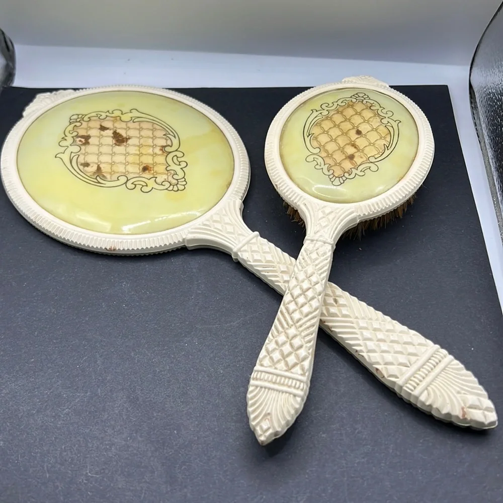 Vintage French ivory celluloid vanity mirror and brush set